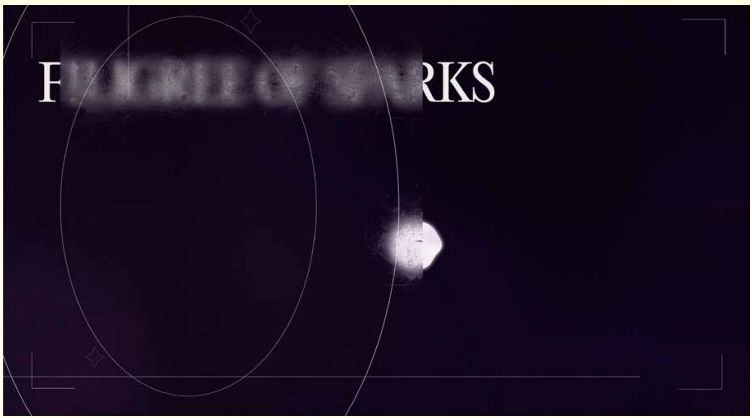 Blurred text "Filigree of Sparks" with a glowing point of light