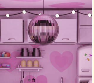 A pink disco ball hanging above kitchen cabinets