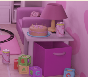 A cake and lamp on a side table with toy blocks